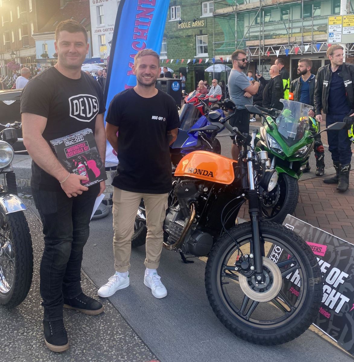 Two man standing next to motorbike in poole 